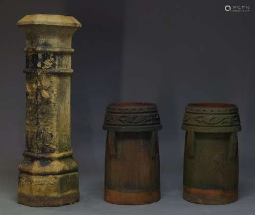 A large clay chimney, 19th Century, of octagonal form, 120cm high, together with a pair of