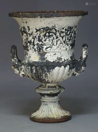 A Victorian cast iron and white painted Campana garden urn, with flared rim and handles emitting