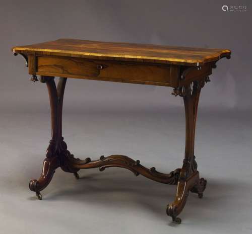 A William IV rosewood side table, the rectangular top with shaped serpentine ends, above single