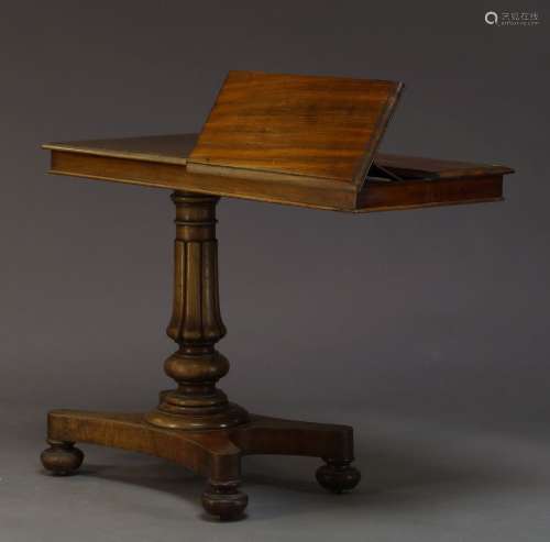 A Regency mahogany reading table, the rectangular top with two reading stands on ratchet mechanisms,