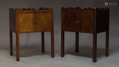 A pair of George III style mahogany bedside cabinets, late 20th Century, the tray tops, with