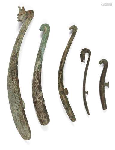 Five Chinese bronze belt hooks, Warring States - Han dynasty, one inlaid with gold, two inlaid