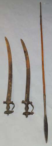 A pair of Indian talwar swords, 19th century, with curving blades, cross form guards and shaped