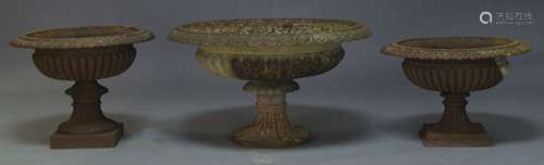 A large Victorian cast iron Campana garden urn, with flared rim over lobed body to fluted socle on