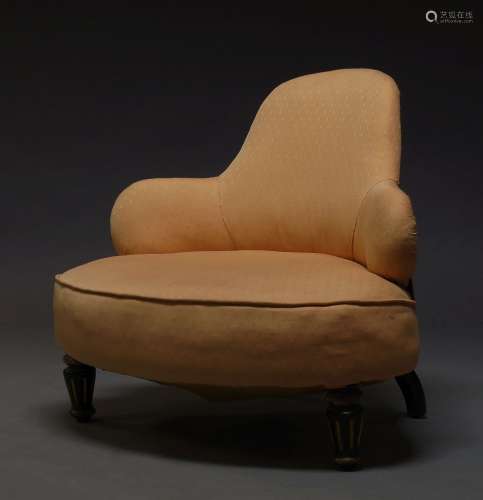 A Victorian nursing chair, with shaped back, upholstered in salmon pink material, raised on ebonised