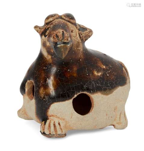 A Chinese pottery whistle in the form of a goat, Tang dynasty, in recumbent pose with four short