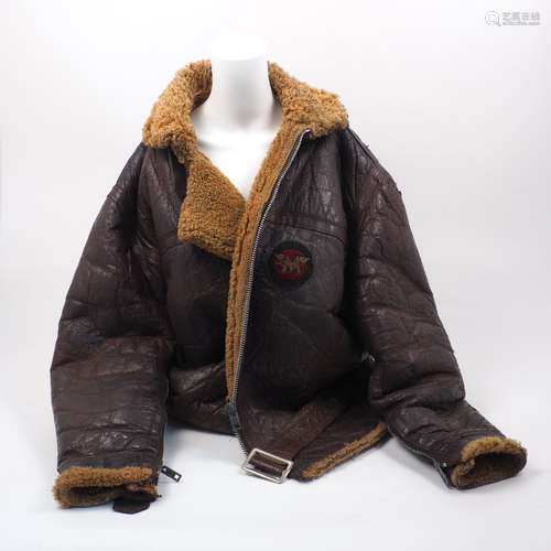 An Irving style sheepskin bomber jacket, probably post-war, with later unknown insignia to the