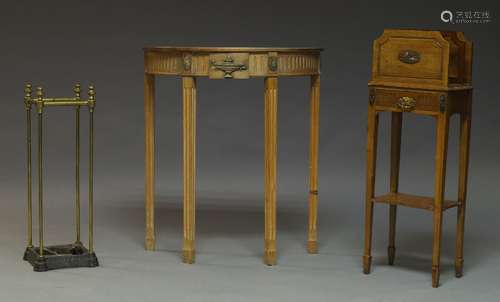 A pine demi lune side table, late 20th Century, the frieze with centred by carved vase and flanked