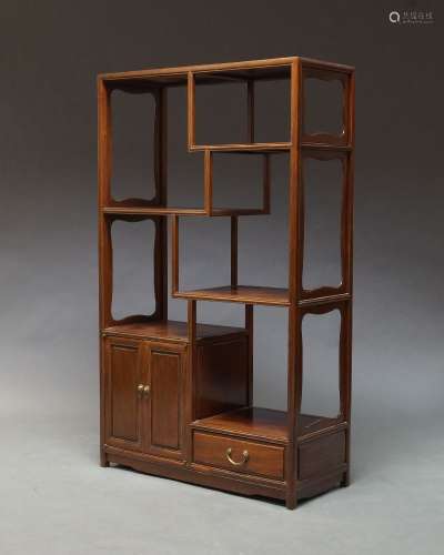 A Chinese hardwood display unit, late 20th Century, of rectangular form, with an arrangement of