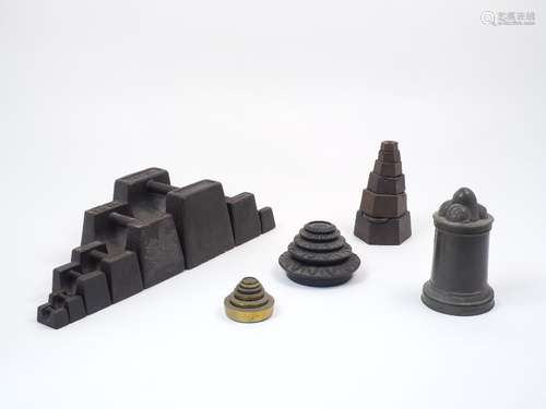 A collection of various groups of metal weights, to include eight of brick form, stamped V & T Avery