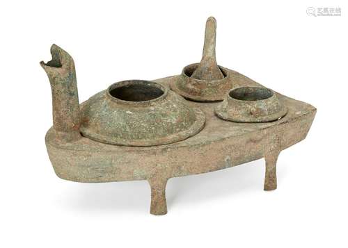 A Chinese bronze zoomorphic stove, Han dynasty, modelled as a stylised turtle, with head forming the