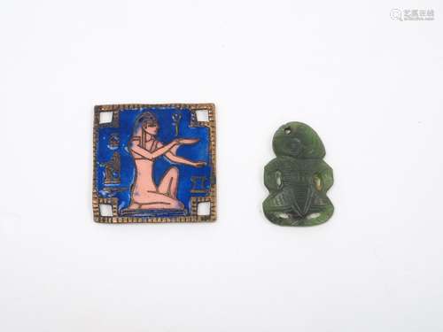 A Maori nephrite Tiki, 2cm high, together with an enamelled plaque of lapis blue ground, each side