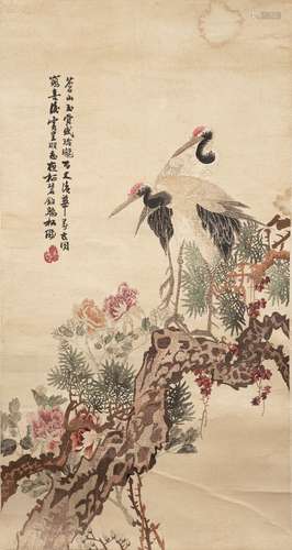 A Chinese silk embroidered hanging scroll, 19th century, decorated with two red-crested cranes,