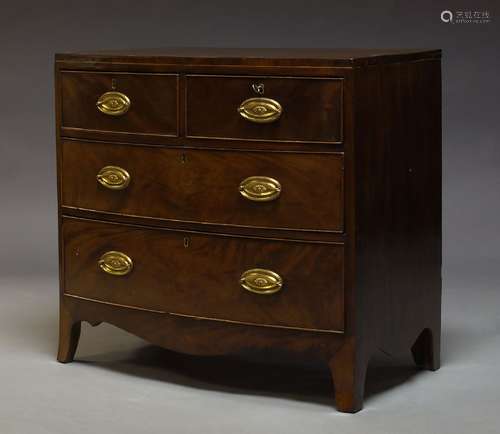 A Regency mahogany bow front chest of drawers, with two short over two long drawers, above shaped