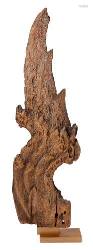 A historical wood fragment, carved as a serpent hydra head motif, with extended necks, terminating