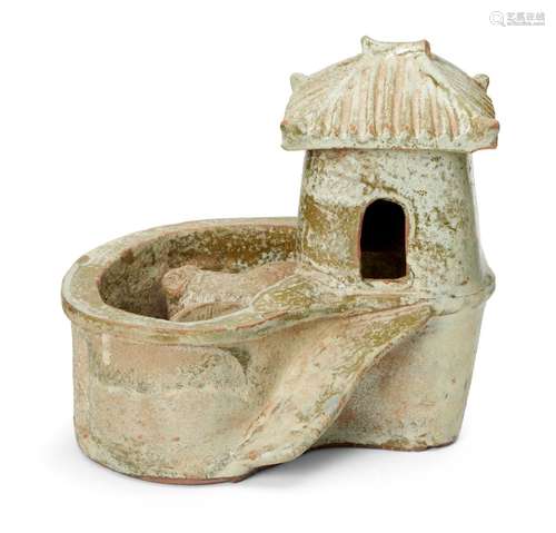 A Chinese pottery model of a pig sty latrine, Han dynasty, the raised square hut with ridged sloping