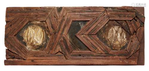 A Central American carved wooden ceiling panel fragment, designed with recurrent hexagonal