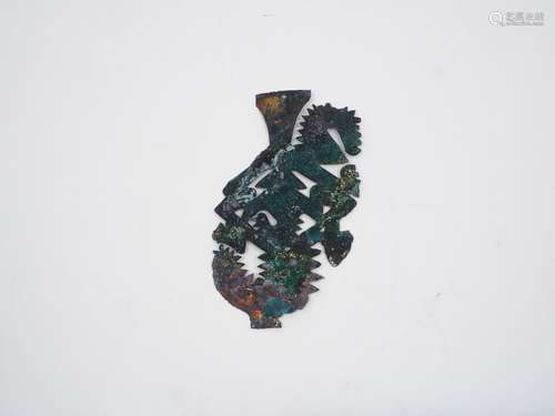 A Mixtec bronze plaque/pendant, the heavily patinated and tarnished body with a stylised spiked