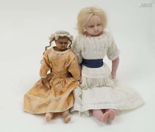 A Victorian poured wax doll, circa. 1860, with fixed blue glass eyes, painted brows and painted