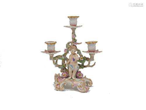 A Berlin porcelain three branch table candelabra, late 19th century, decorated in the Meissen style,