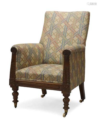 A William IV mahogany open armchair, upholstered in geometric and floral pattern fabric, with