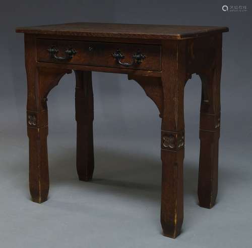 A Victorian Gothic Revival oak side table, the rectangular top above single frieze drawer, on