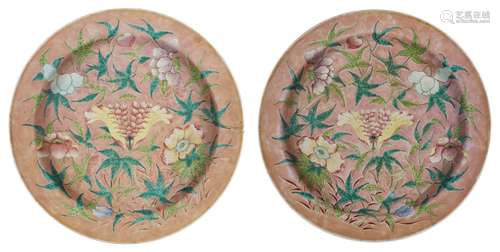 A pair of Chinese porcelain chargers, early 19th century, painted in famille rose enamels with