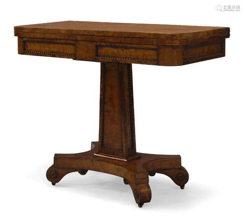 A Regency figured blonde wood card table, the fold-over top, enclosing green baize lined playing