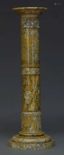 A variegated yellow and grey marble column, first half 20th Century, the circular top on tapered