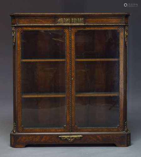 A Victorian walnut, inlaid and gilt metal mounted pier cabinet, the rectangular top above frieze