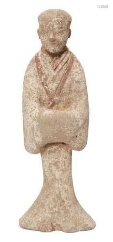 A large Chinese pottery tomb figure, Han dynasty, modelled as a standing court official wearing
