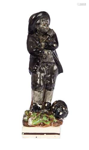 A Staffordshire pearlware figure of a chimney sweep, early 19th century, with a sack of soot and a