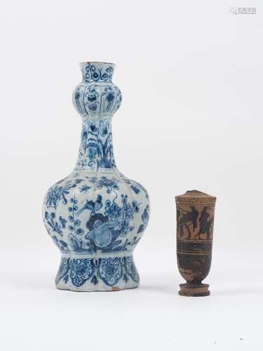 A Delft vase, late 18th century/early 19th century, the baluster body rising to slender neck with an