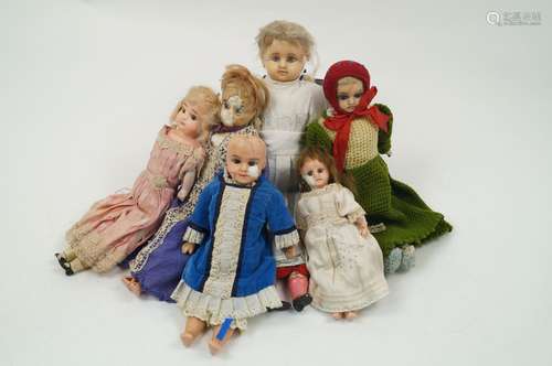 A collection of six reinforced wax dolls, 19th century and later, in varying conditions and outfit