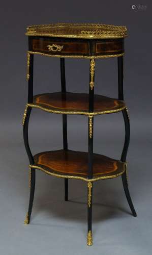 A French walnut, ebonised and gilt metal mounted three tier etagere, late 19th Century, the shaped