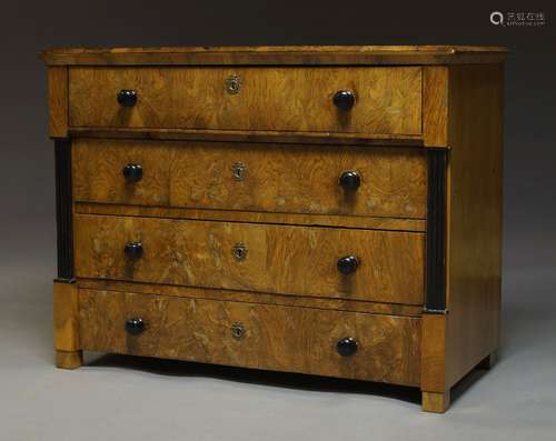 A Biedermeier walnut and ebonised secretaire chest, 19th Century, the top secretaire drawer