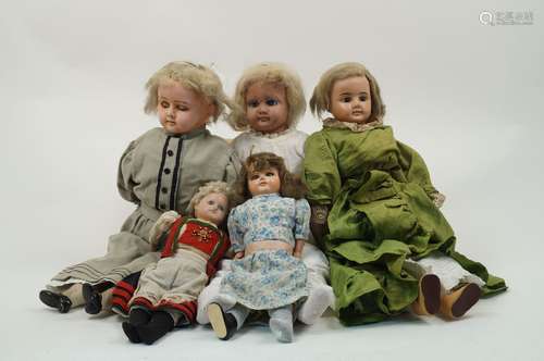 A collection of five composition dolls, 19th century and later, to include: a fixed brown eyes