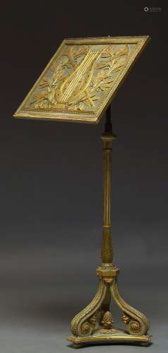 A grey painted and parcel gilt music stand, 19th Century, the rectangular stand decorated with lyre,
