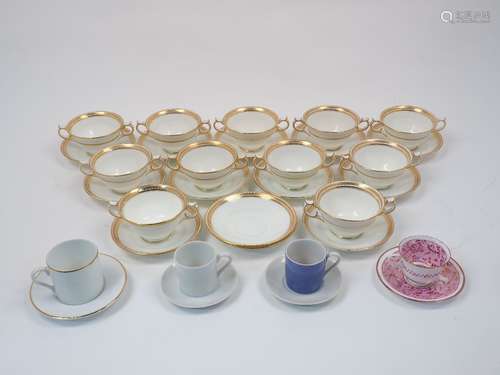 A group of ten George Jones & Sons twin handled pudding cups, with thirteen saucers, 19th Century,