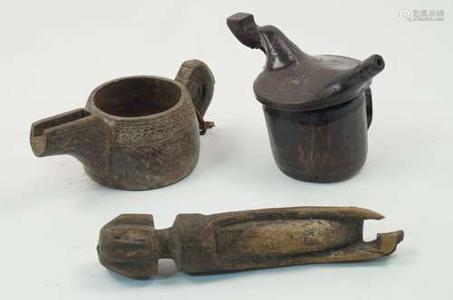 A carved wood tribal interest water vessel and cover, of cylindrical form, the cover with spout