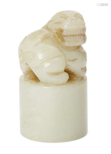 A Chinese pale green jade seal, late Qing dynasty, carved with a snarling Buddhist lion, 4.5cm highA