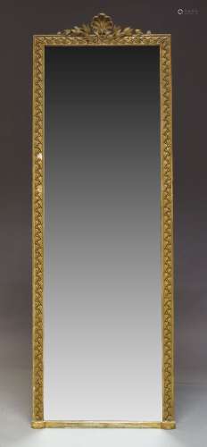 A gilt gesso hall mirror, late 19th, early 20th Century, of rectangular form, the crest with scallop
