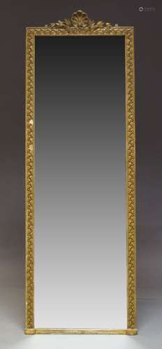 A gilt gesso hall mirror, late 19th, early 20th Century, of rectangular form, the crest with scallop