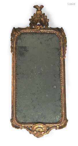 An Italian giltwood mirror, probably Venetian, 19th century, with cresting and apron centred by a