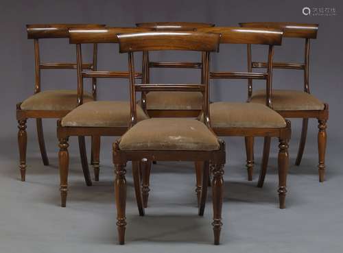 A set of six Regency rosewood bar back dining chairs, with curved bar backs above drop in velvet