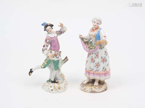 A Meissen porcelain figurine of a dancing man, decorated in a purple jacket with green hosiery, blue