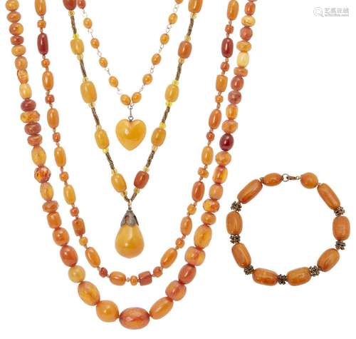 A collection of amber jewellery, early 20th century, comprising four bead necklaces and a