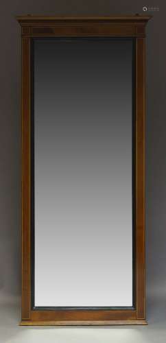 An Edwardian mahogany and line inlaid wall mirror, with dentil moulded cornice, the rectangular