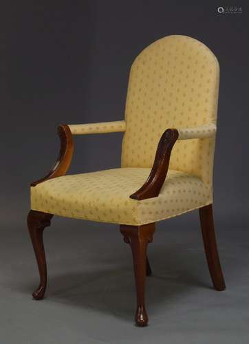 A Georgian style armchair, late 20th Century, with yellow floral pattern upholstery, with