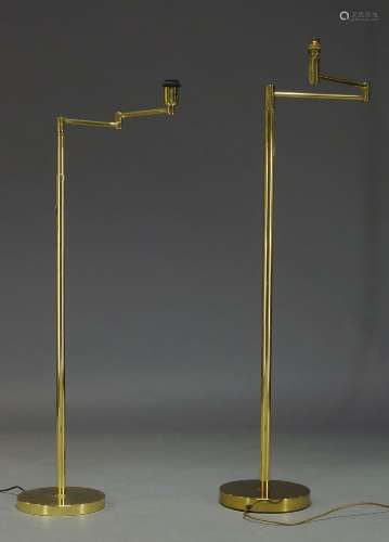 A brass standard lamp, of recent manufacture, with adjustable arm on cylindrical and adjustable stem
